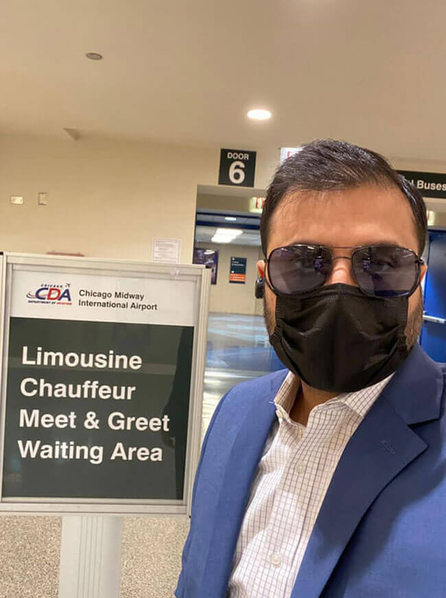 Chauffuer Standing at Meet and Greet waiting Area at Airport