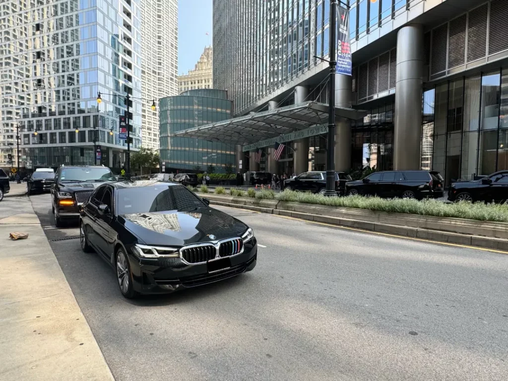 Luxury Black Sedan and SUV on Road